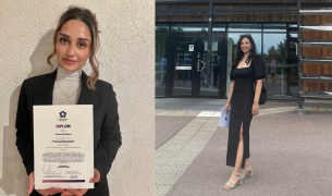 Two students holding diplomas and posing for the camera.