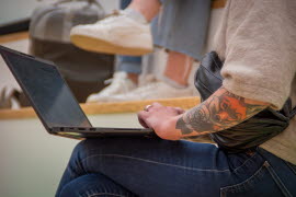 student with computer