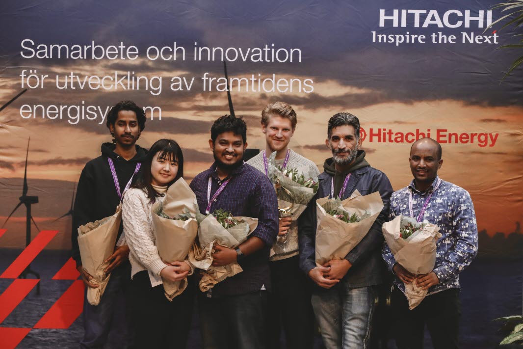 A group of students are holding bouquets of flowers.