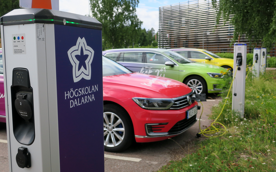 Electric vehicle and charger outside